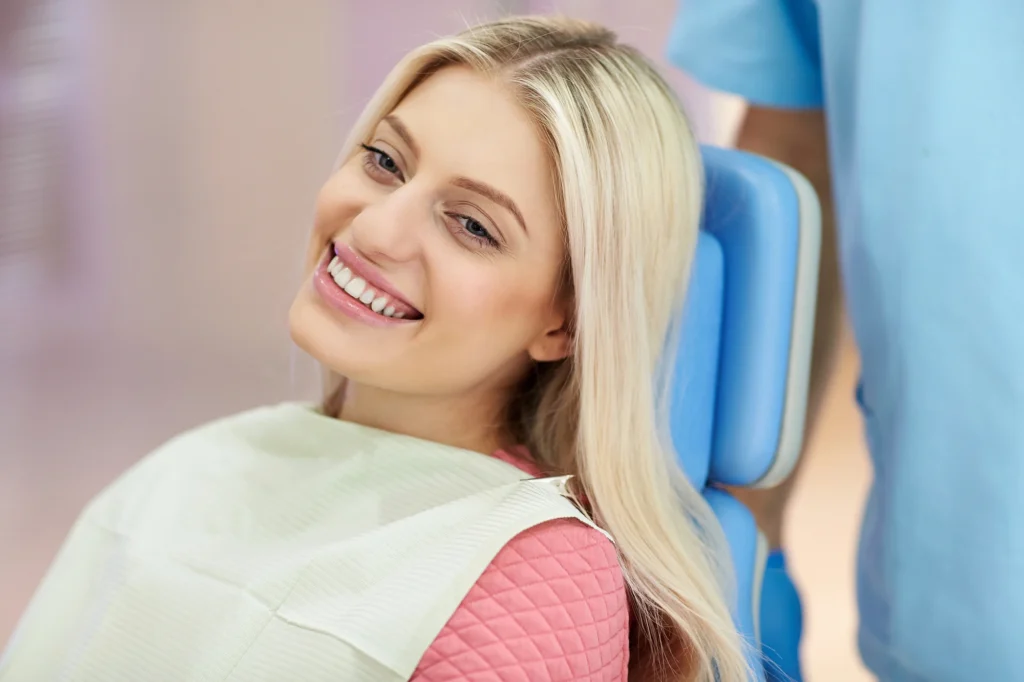 Woman smiling while visiting the best root canal specialists near Grovewood