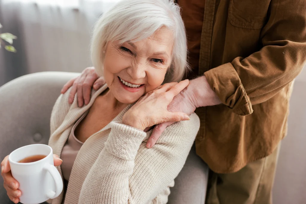 older lady smiling because of dentures made in Imperial Courts Clearwater