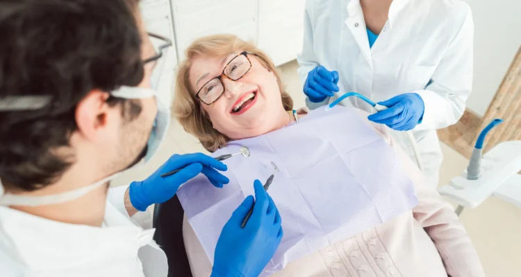 older woman at dentist for dentures made in Imperial Courts Clearwater
