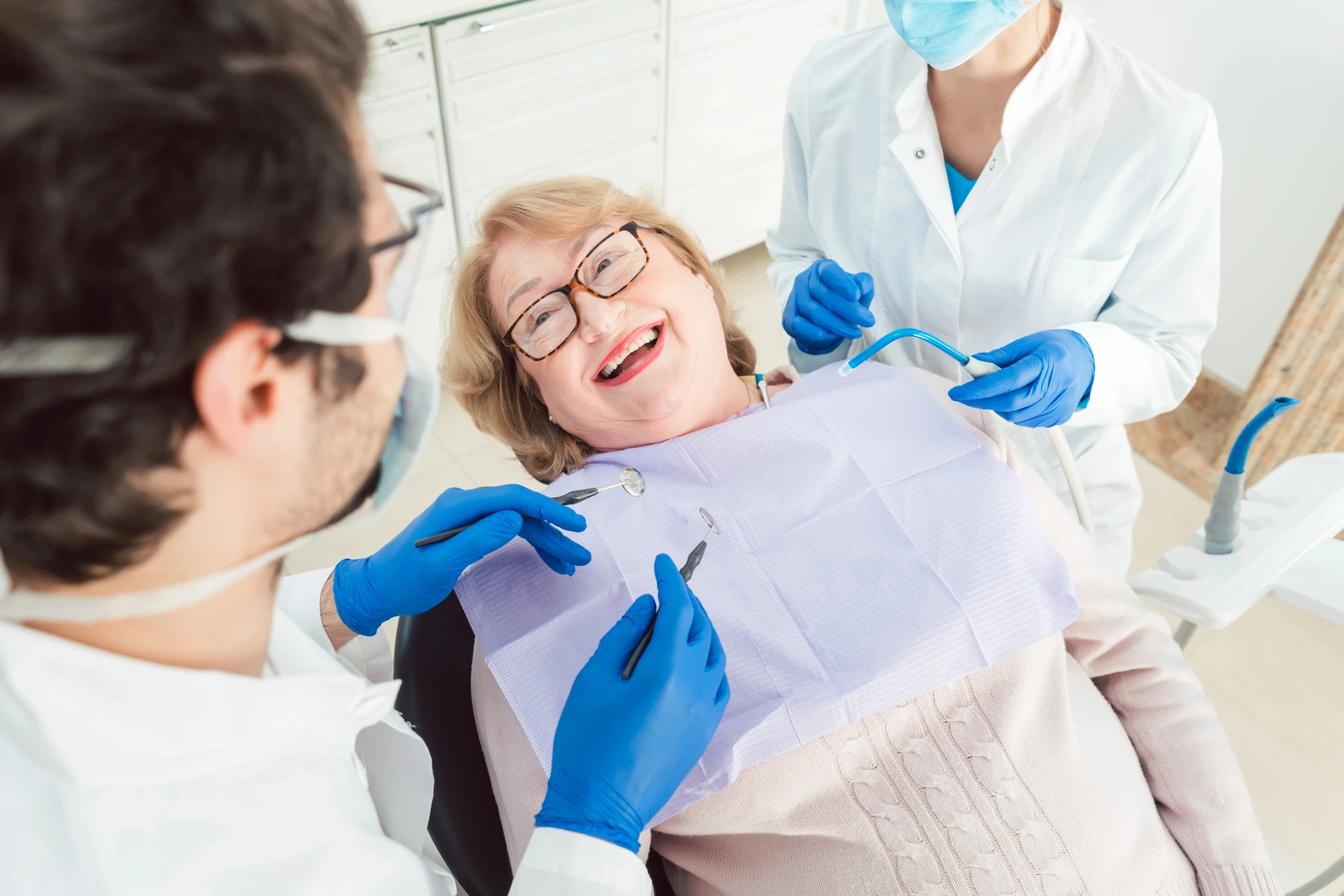older woman at dentist for dentures made in Imperial Courts Clearwater
