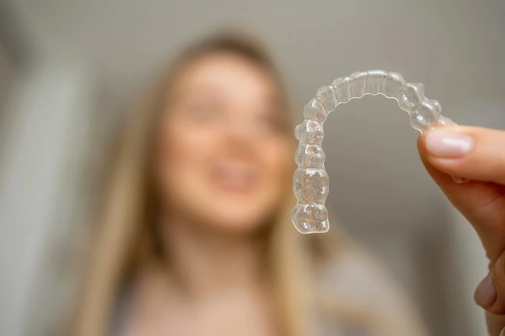hand holding aligners from Clear aligners provider near MorningsideMeadows