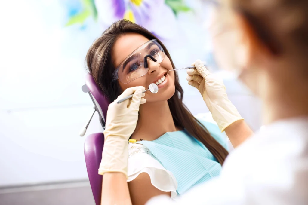 smiling woman after getting root canal in st petersburg