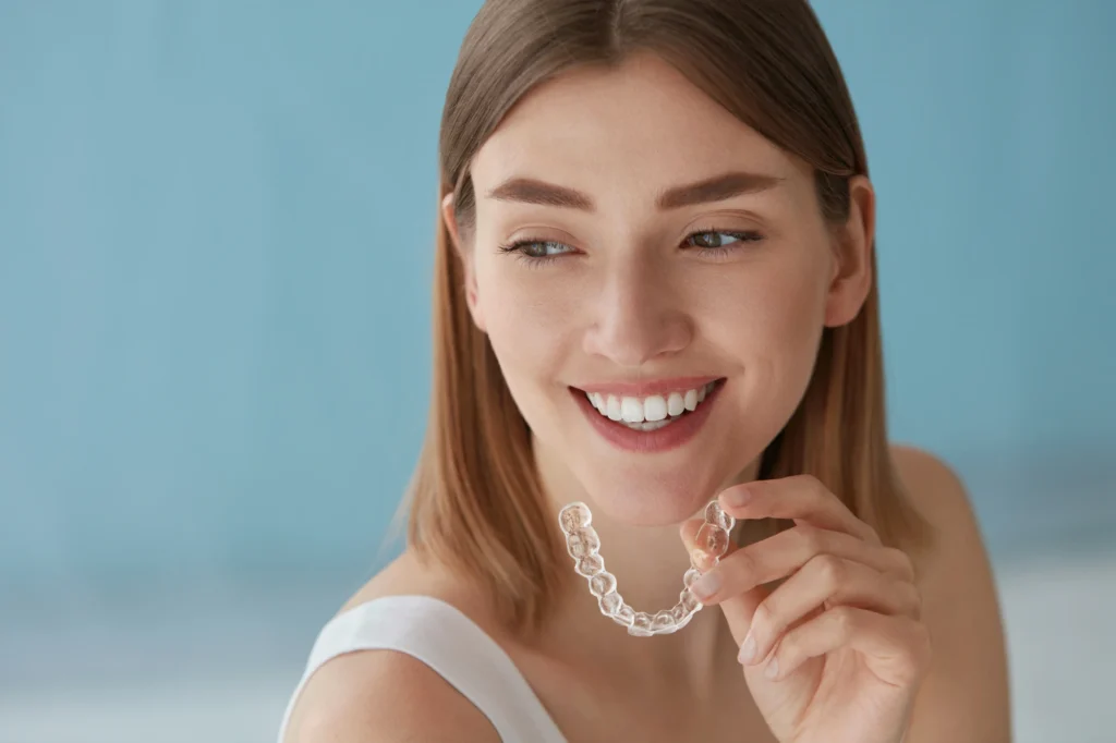 woman using aligners from Clear aligners provider near MorningsideMeadows